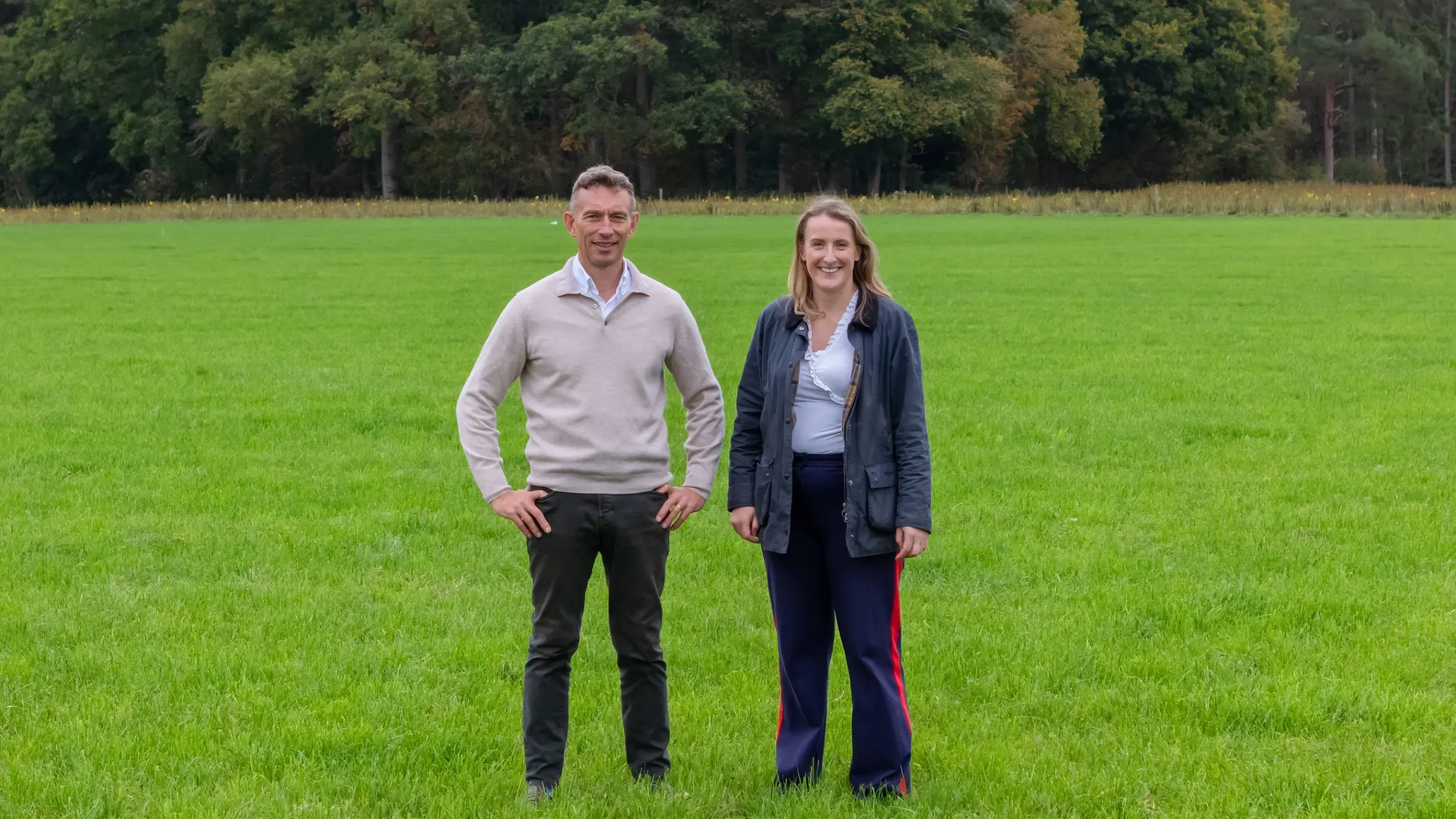 A man and woman standing in a fiels smiling at the camera - video thumbnail