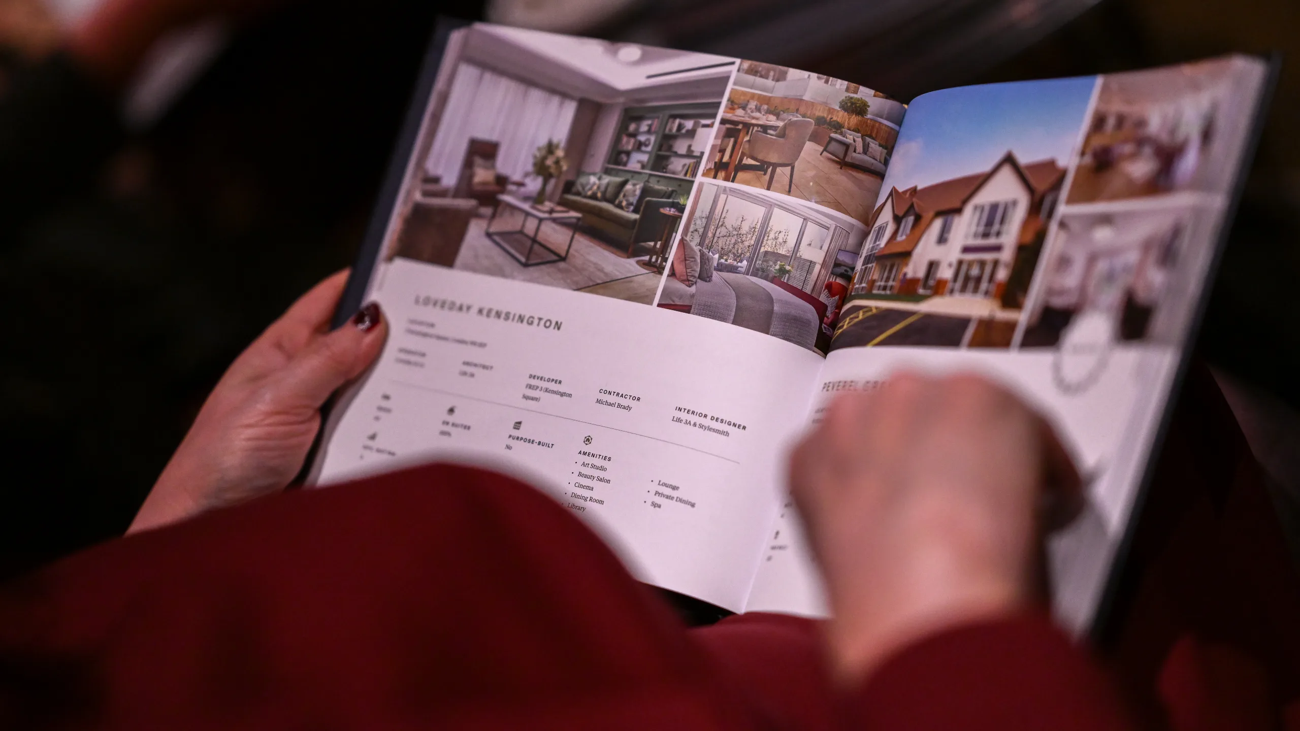 A person is reading a magazine that contains pictures of care homes.