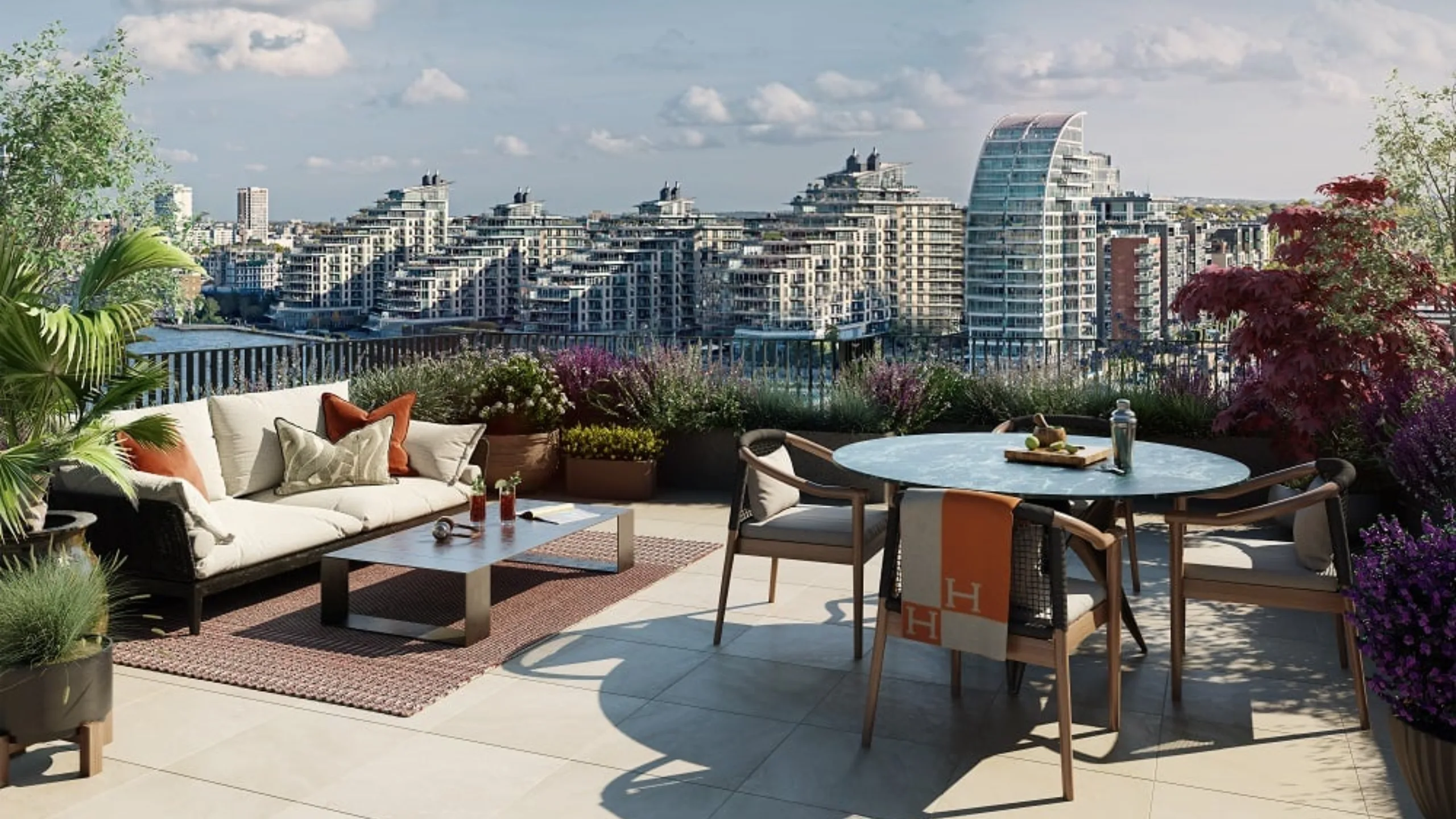 Rooftop terrace garden with a dining table and chairs and armchair, overlooking high rise buildings