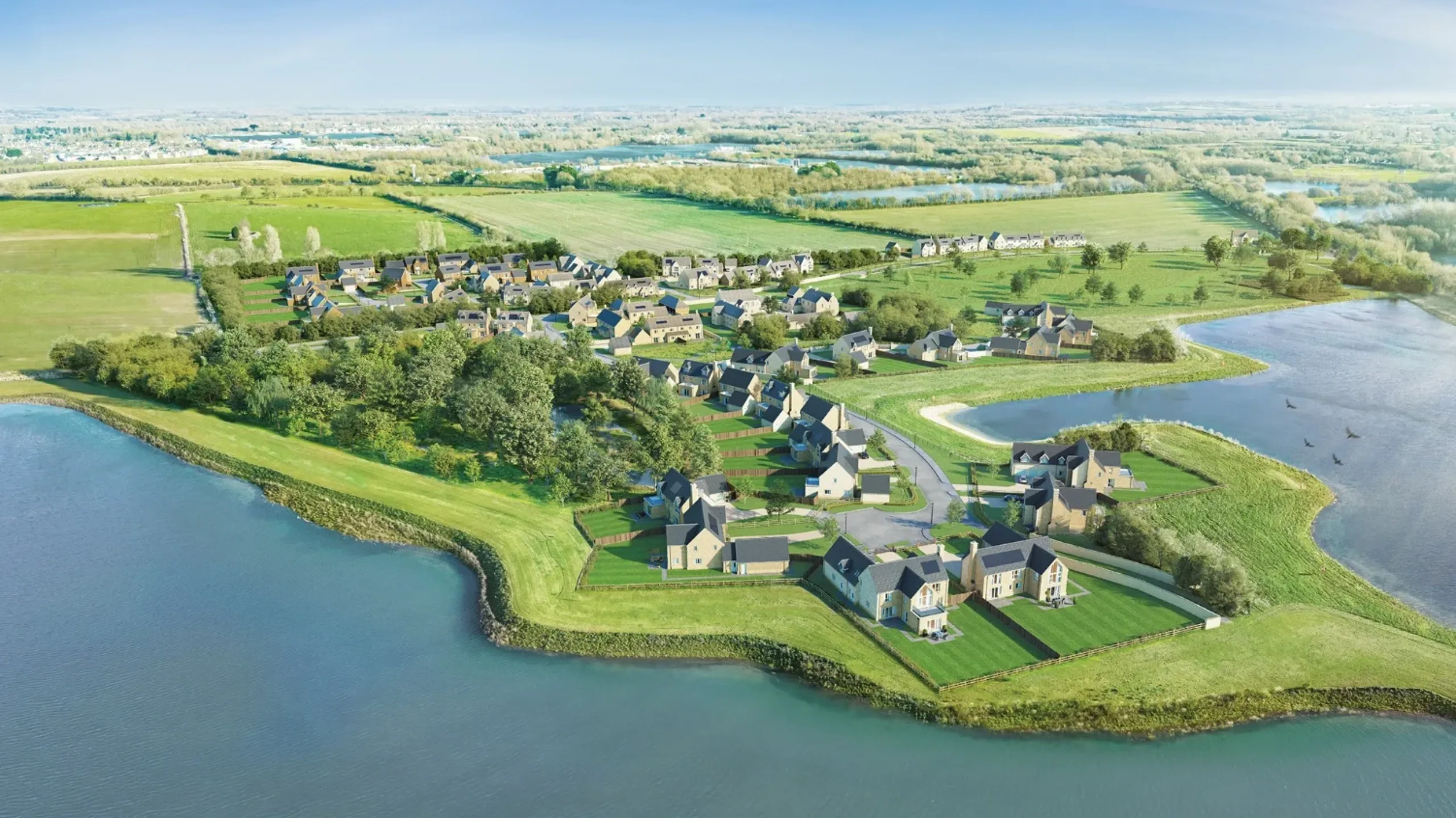 Ariel shot of collection of houses surrounded by a lake