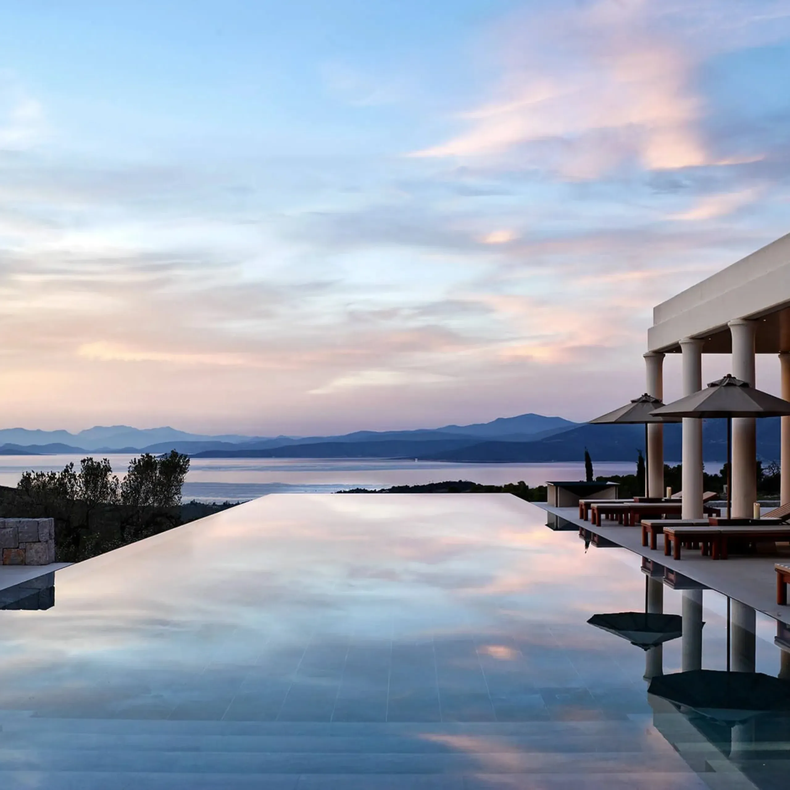 a luxury apartment with a swimming pool overlooking the ocean amanzoe