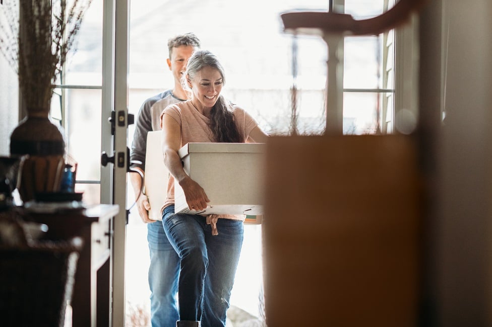 A young couple moving in to their new home