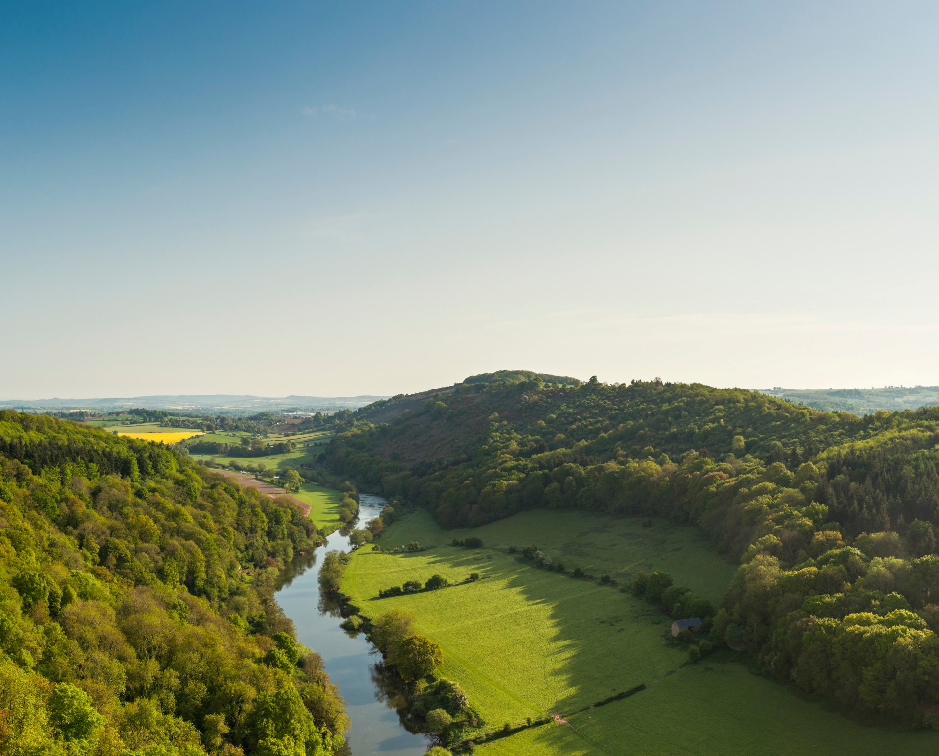 A river running through green countryside scenery