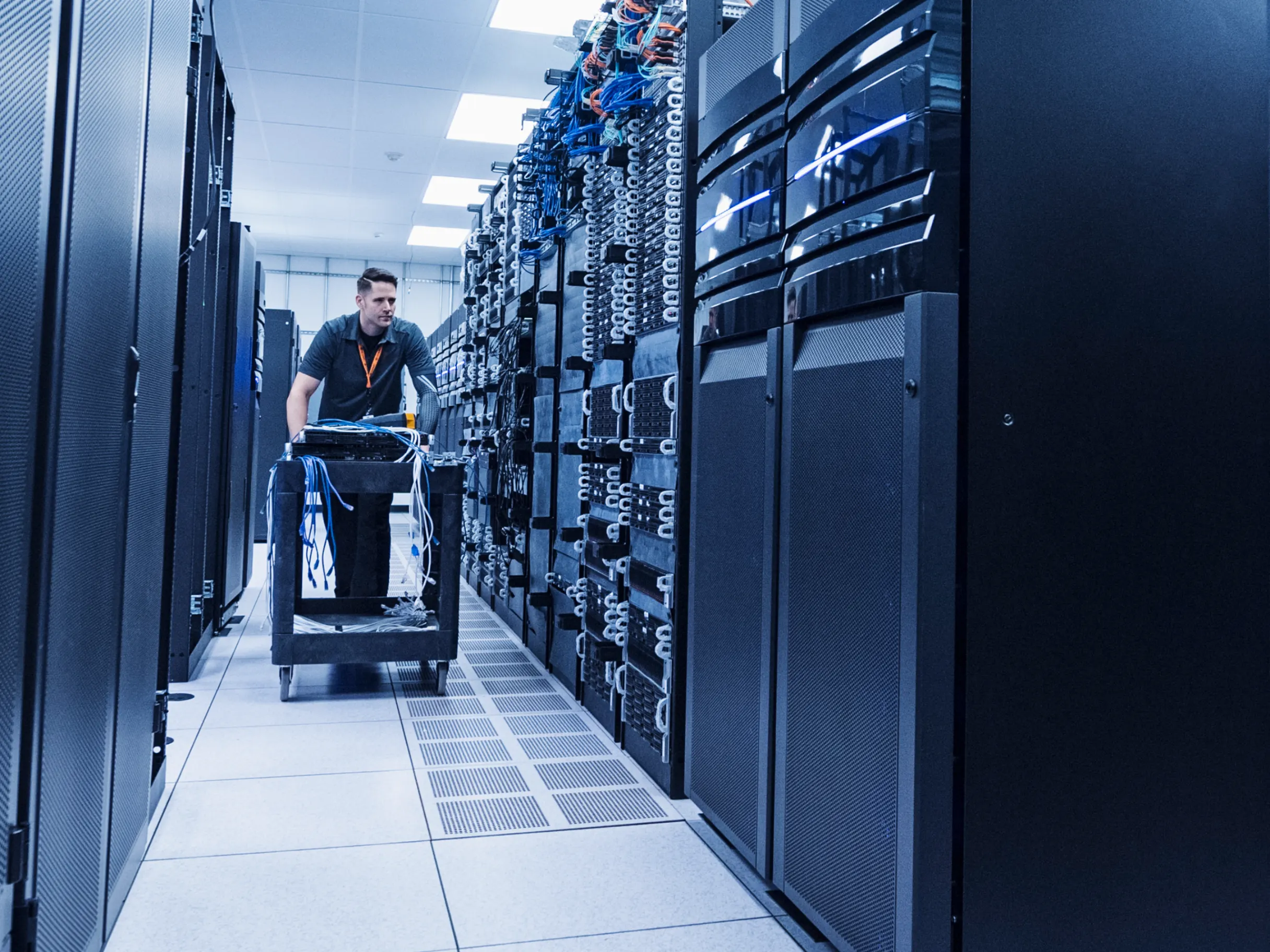 man-working-in-server-room-cart