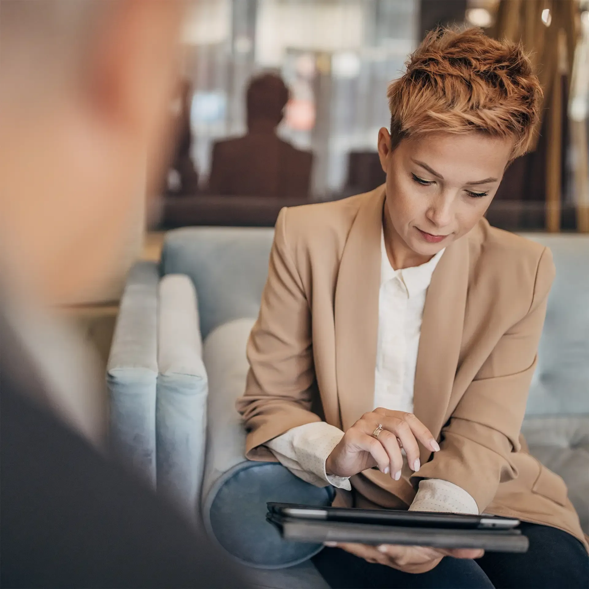 Father and daughter talking about business in luxury hotel