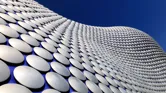 A wide angle view of the very modern and iconic Bullring building in Birmingham, England.