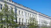 Georgian terraced apartments in a street in Cheltenham, England.