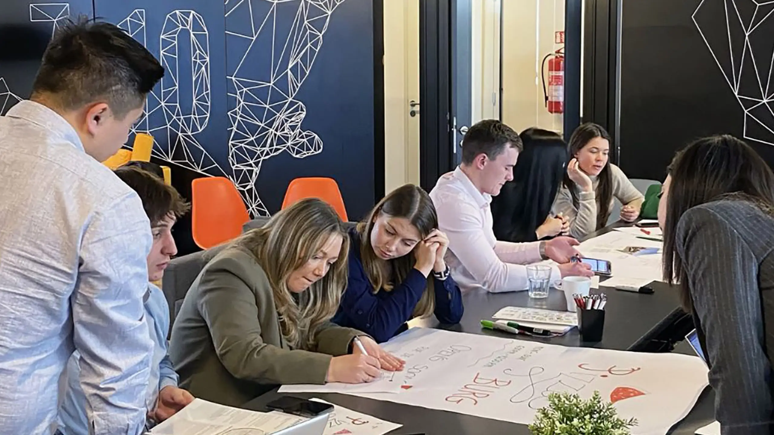 Group of Knight Frank staff collaborating in a meeting