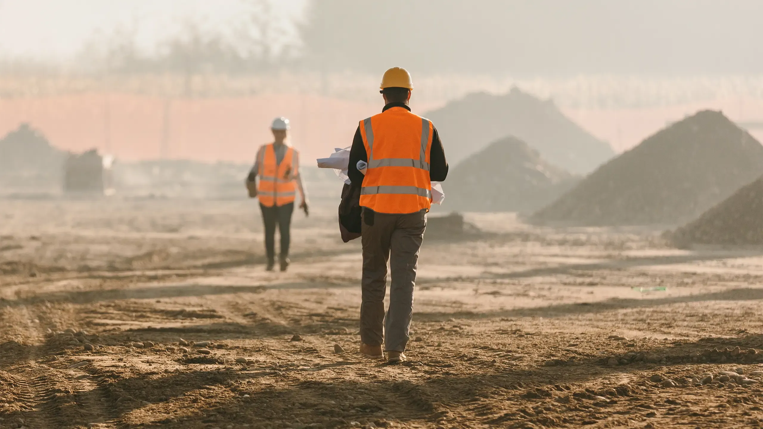 Building contractors evaluating work at construction site