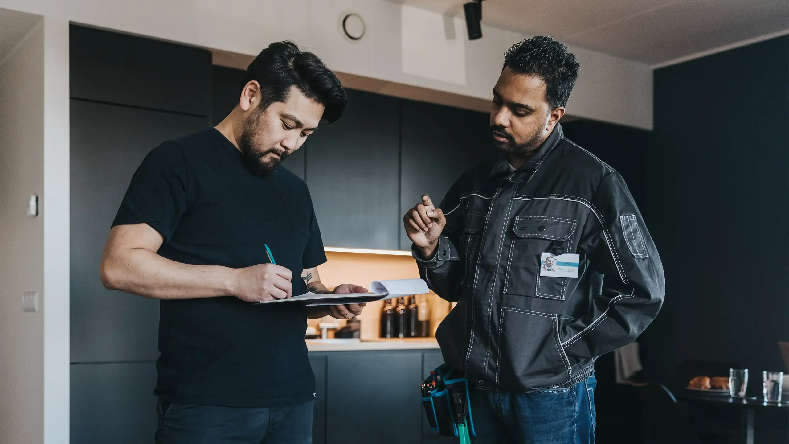 Japanese customer signing network contract at home.