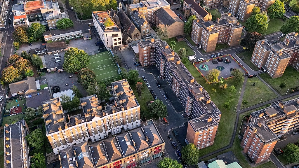 UK, London, elevated view over residential buildings at sunset