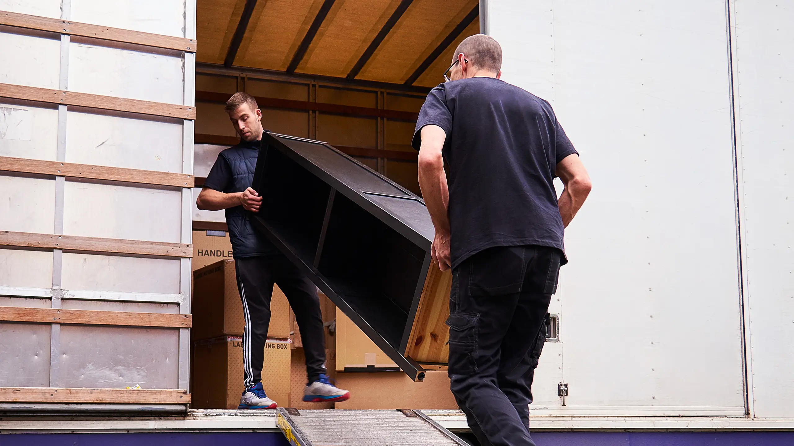 Removal company helping a family move out of their old home