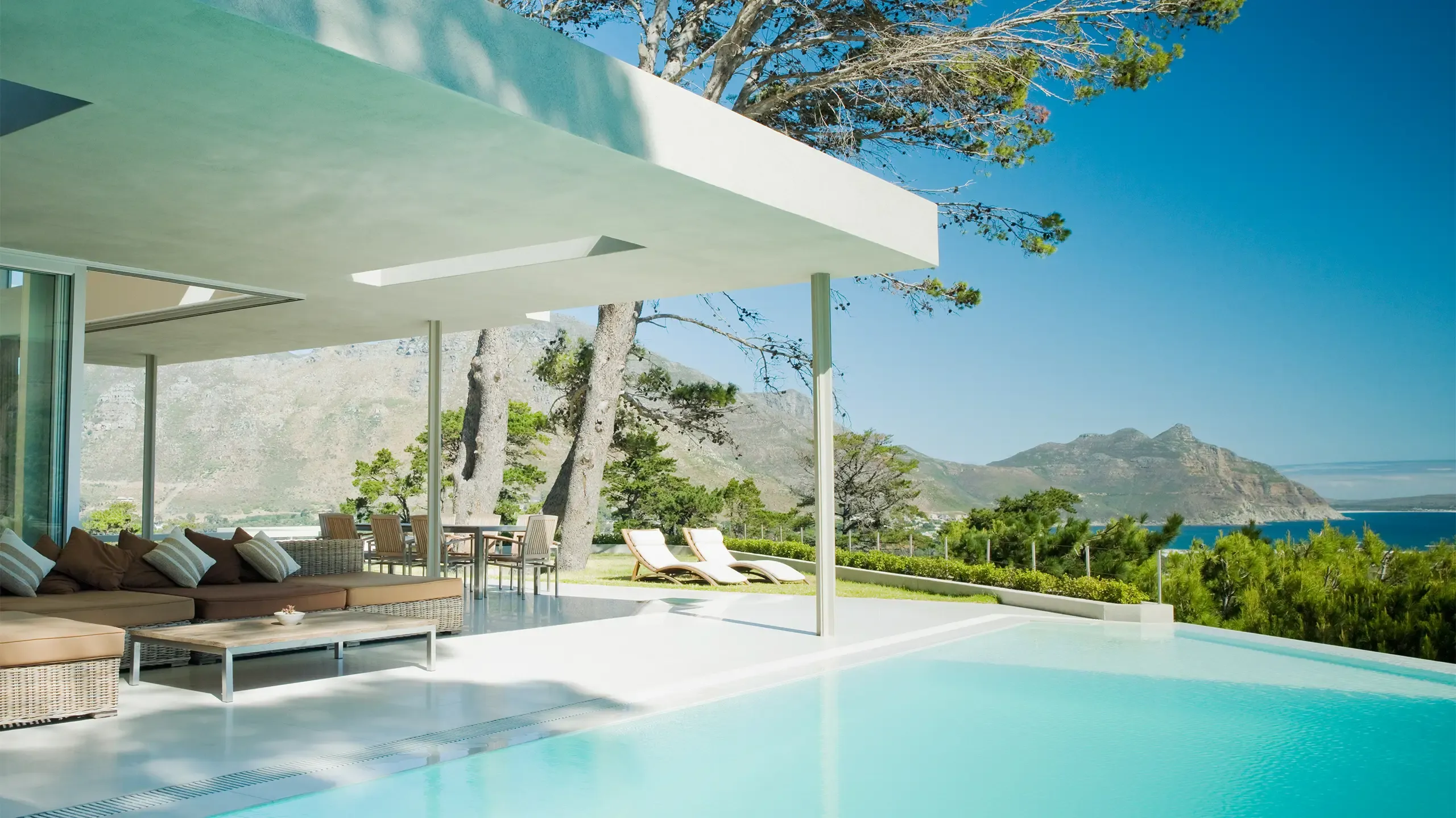 Modern home, patio and infinity swimming pool