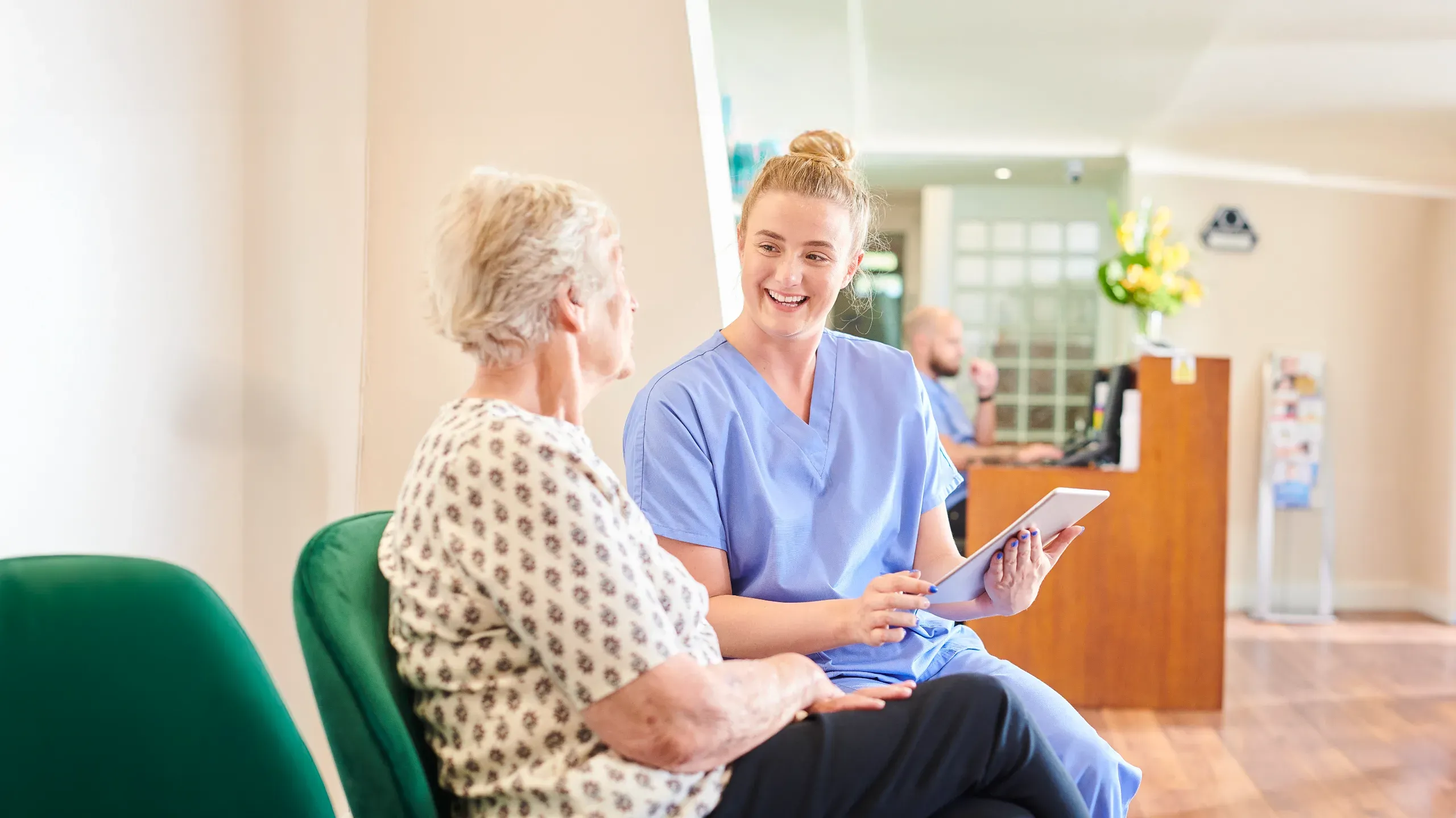 Patient with nurse sitting in the doctor's office
