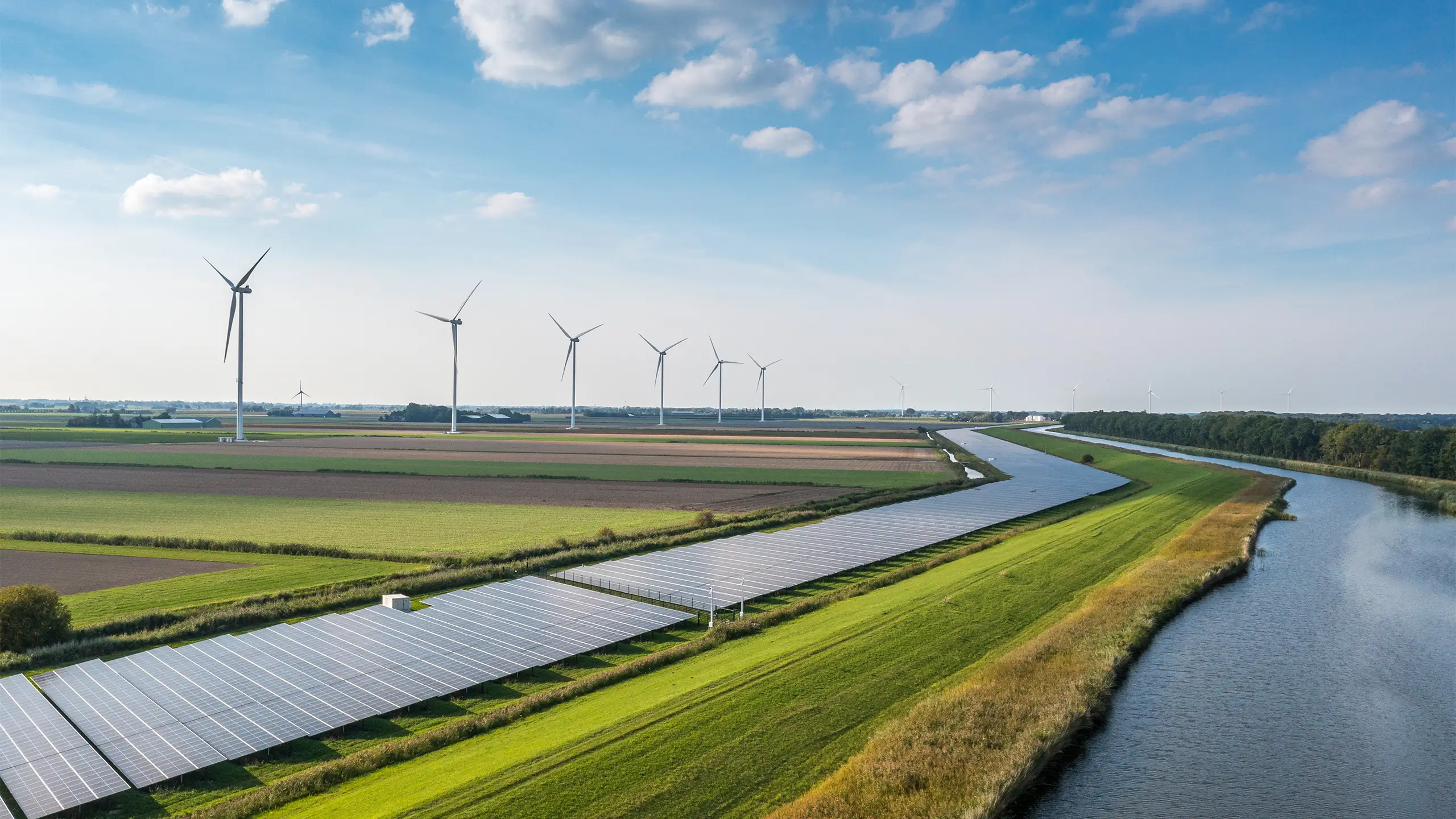 Solar panels and wind turbines generating renewable energy for green and sustainable future.