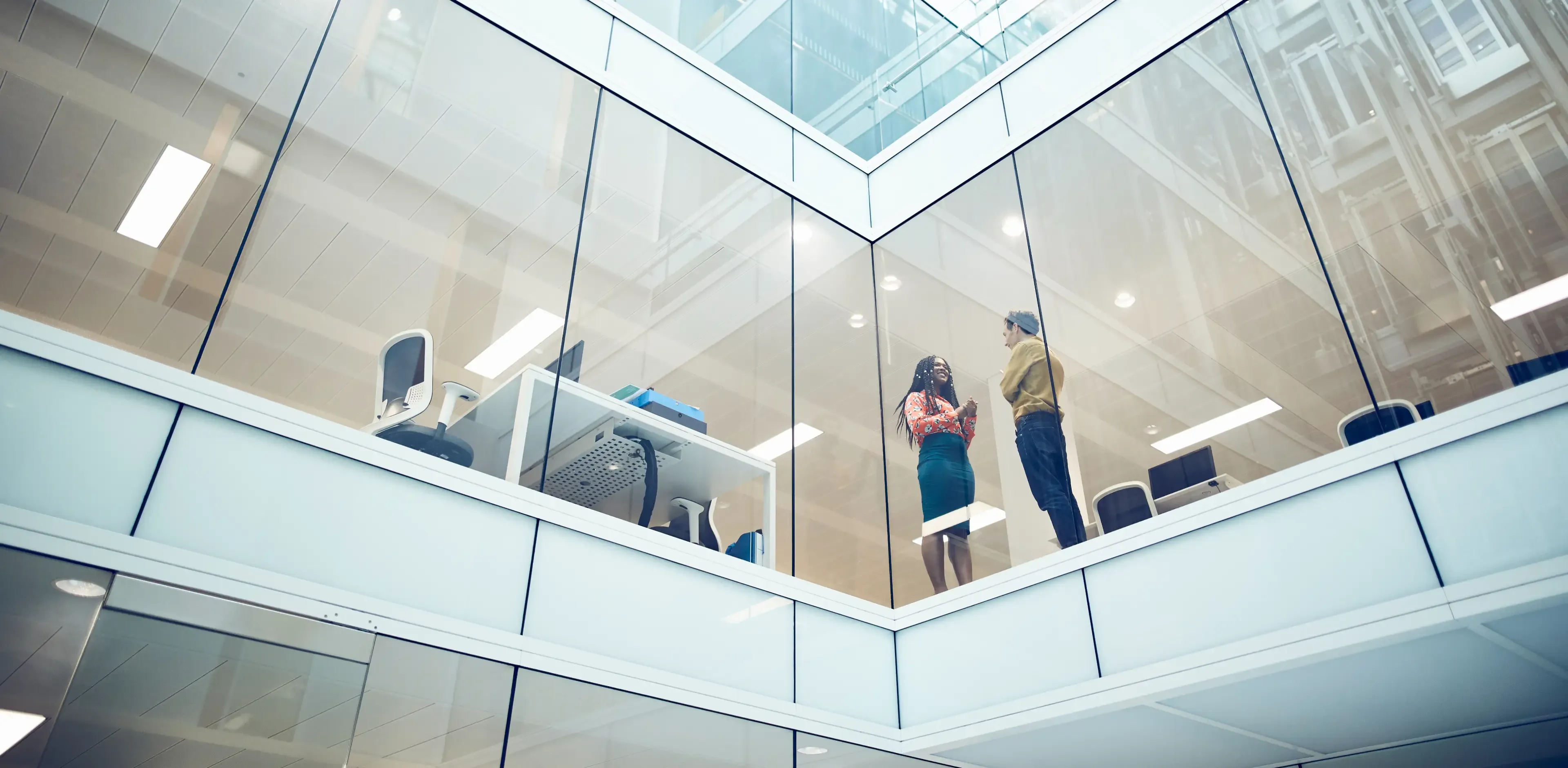 Work colleagues talking in modern office