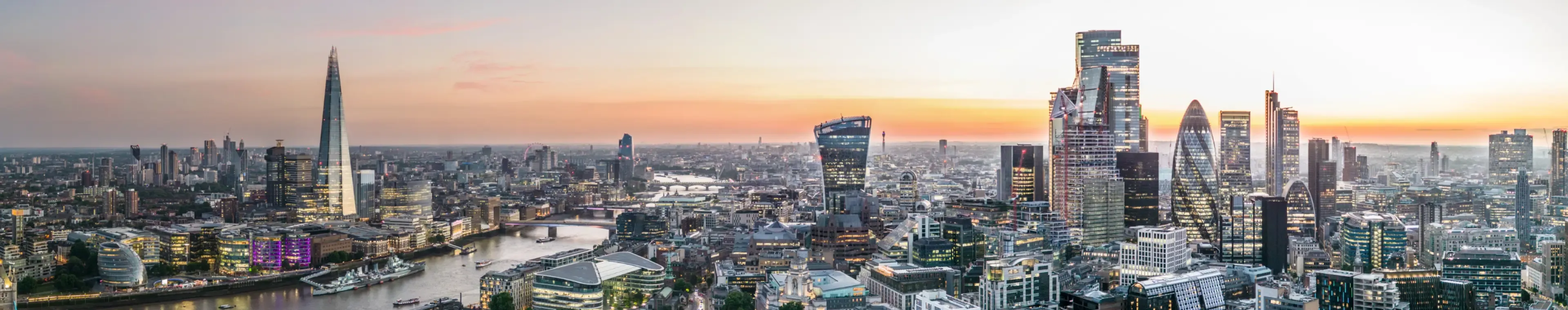A panoramic view of London with Tower Bridge, the River Thames, the Shard and the Tower of London