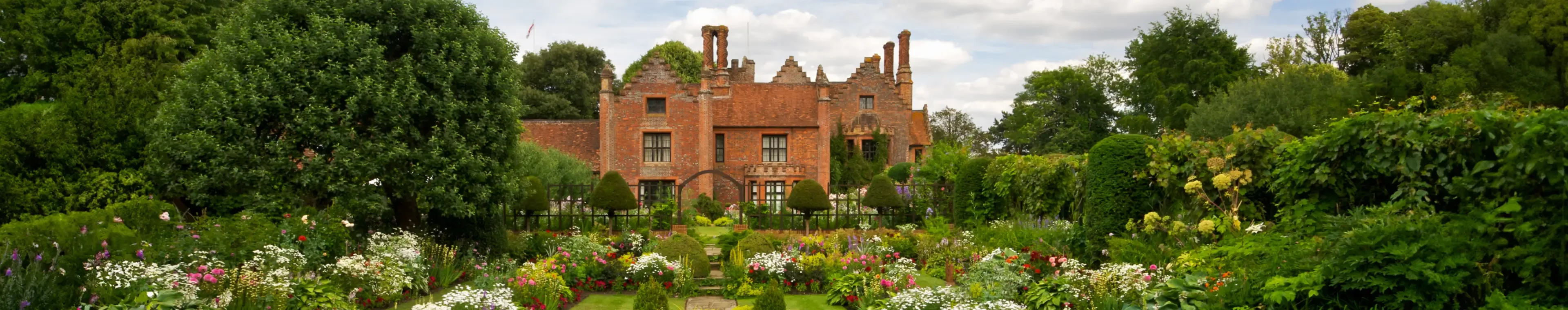 The beautiful award winning gardens of Chenies Manor in Buckinghamshire with a wide variety of flowering plants and shrubs.