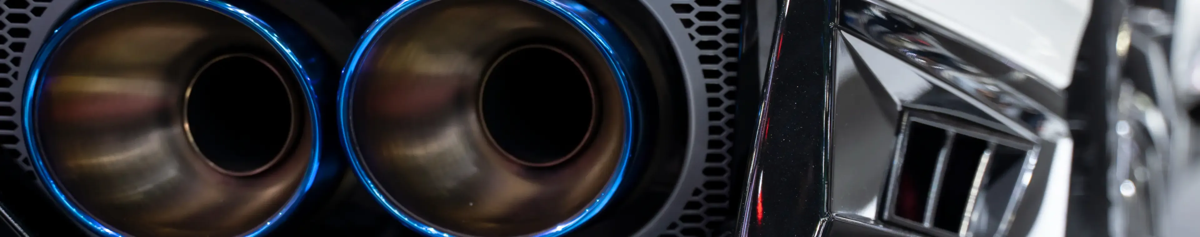 Close up of a car dual exhaust pipe