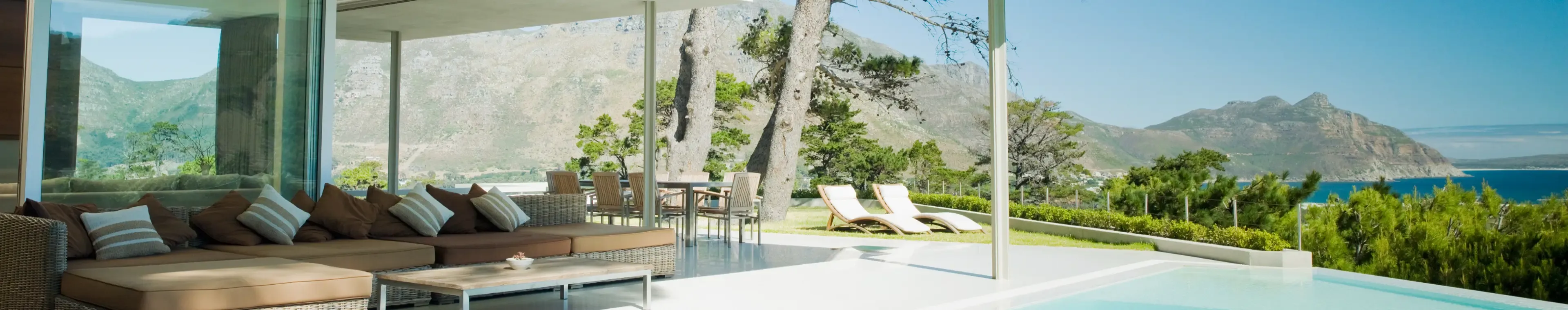 Modern home, patio and infinity swimming pool