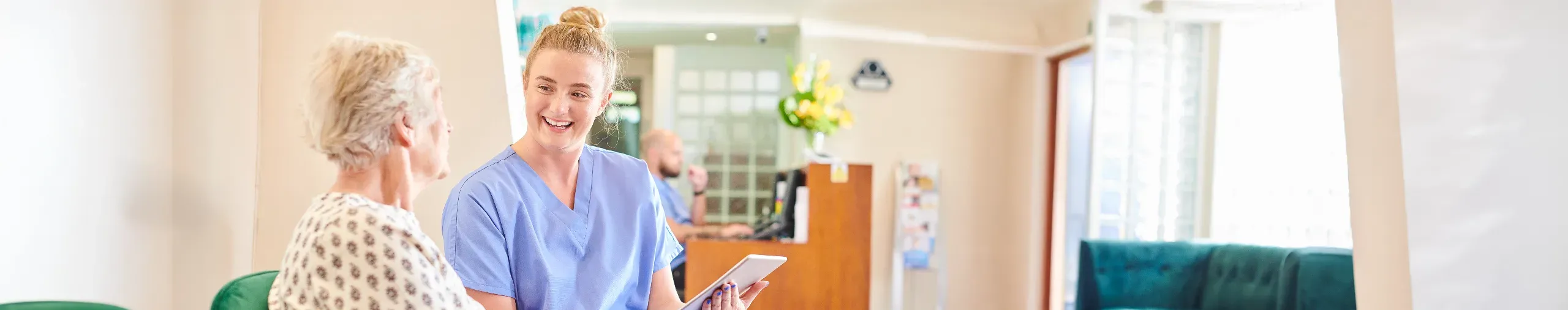 Patient with nurse sitting in the doctor's office