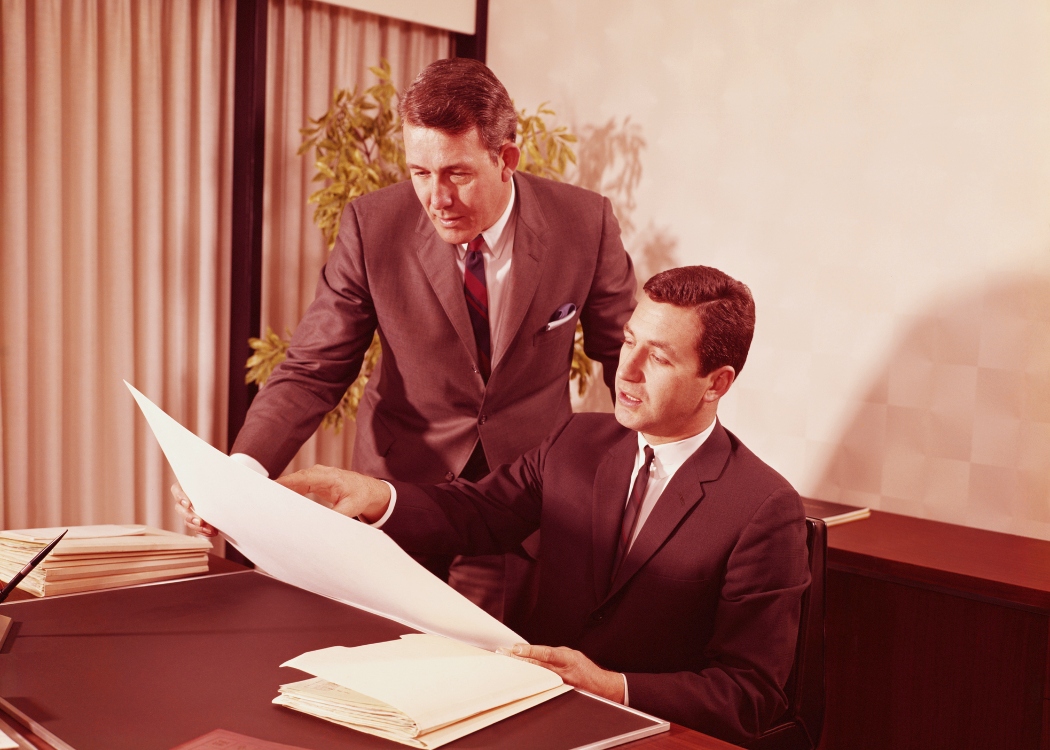 1960s_ Two male executives in office