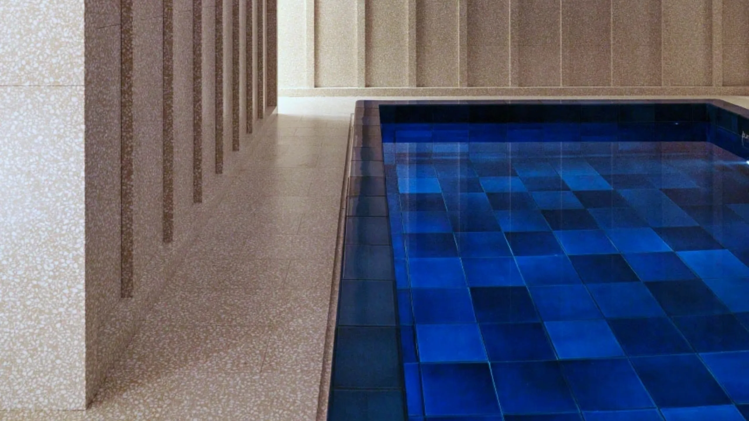 Each tile in this pool was individually handmade and fired by an English ceramicist. Traditional craft takes on a strict contemporary form